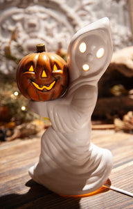 White Ghost Holding Pumpkin